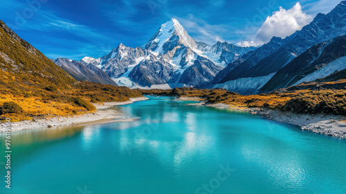 A vast mountain range with snowy peaks, towering over a serene valley with a river winding through it