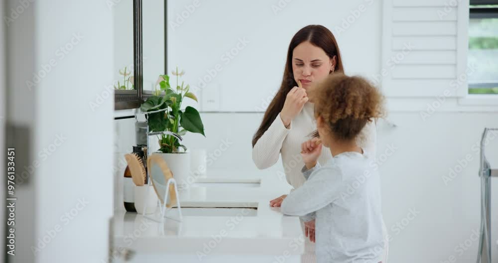 Hygiene oral care and a family brushing teeth in the bathroom of their home together for morning routine. Toothbrush, toothpaste or dental with a mother and daughter cleaning in their apartment Hygiene oral care and a family brushing teeth in the bathroom of their home together for morning routine. Toothbrush, toothpaste or dental with a mother and daughter cleaning in their apartment