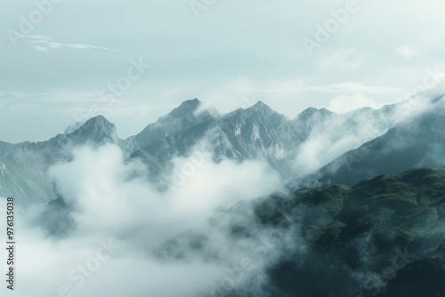 A misty mountain range shrouded in a veil of clouds, creating an air of mystery and tranquility