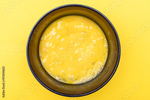 Φωτογραφία Beaten egg yolks in a bowl