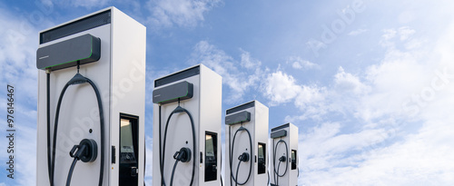 Fotografie Row of electric vehicles charging stations on the background of blue sky