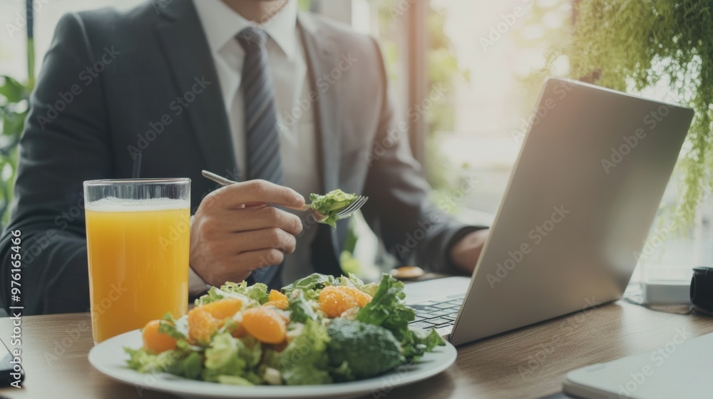 Pro enjoying a healthy lunch with laptop at work Pro enjoying a healthy lunch with laptop at work