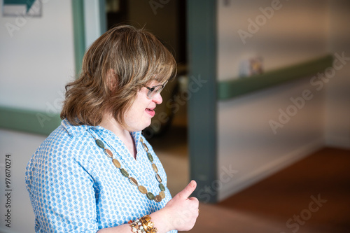 Happy 41 yo woman with Down Syndrome, thumbs up, Tienen, Flemish Brabant, Belgium photo