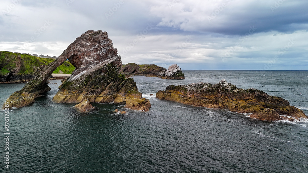 Bird's eye view Ariel drone shot of Bow Fiddle rock, Portknockie, east coast of Scotland Bird's eye view Ariel drone shot of Bow Fiddle rock, Portknockie, east coast of Scotland