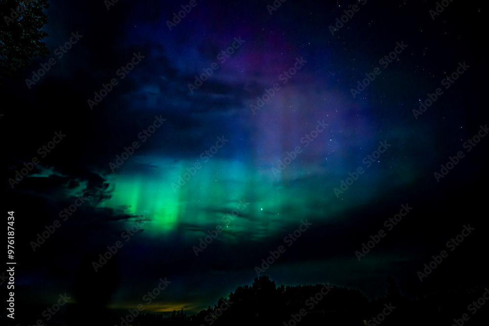 Northern lights dancing over the sky sky in the country road Northern lights dancing over the sky sky in the country road