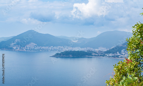 Aerial view over St Stephan island, turquoise sea and mountains from the viewpoint at the mountain. Budva, Montenegro 