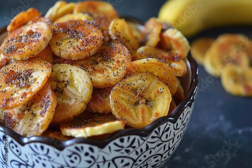 Crispy banana chips in a bowl. Perfect for a healthy snack or a delicious addition to your next meal.