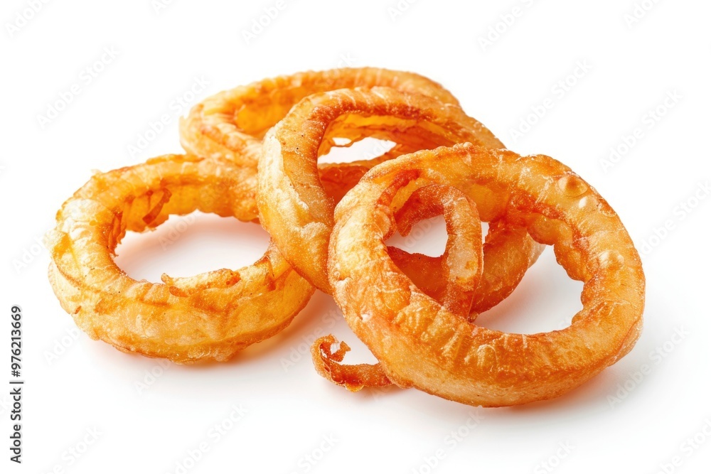 A pile of crispy onion rings on a white surface A pile of crispy onion rings on a white surface