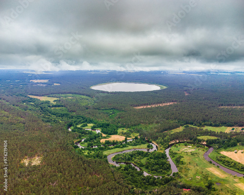 Aerial view of the lake and river in the forest. River Merkys and lake Glebo, Lithuania, Varena district photo