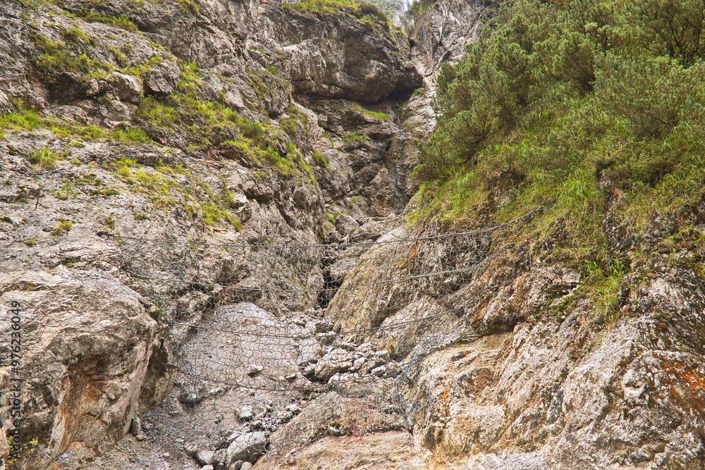 Protection against falling rocks on hiking track in Kundler Klamm, Austria, Europe
Protection against falling rocks on hiking track in Kundler Klamm, Austria, Europe