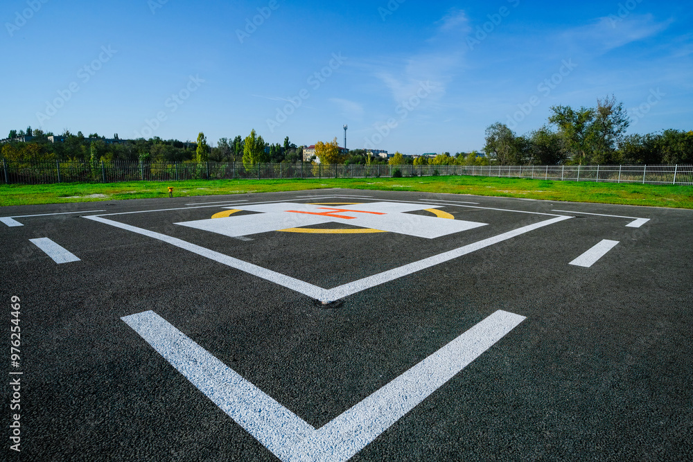 Fototapeta premium Large paved area with a special symbol in the center for helicopter landing