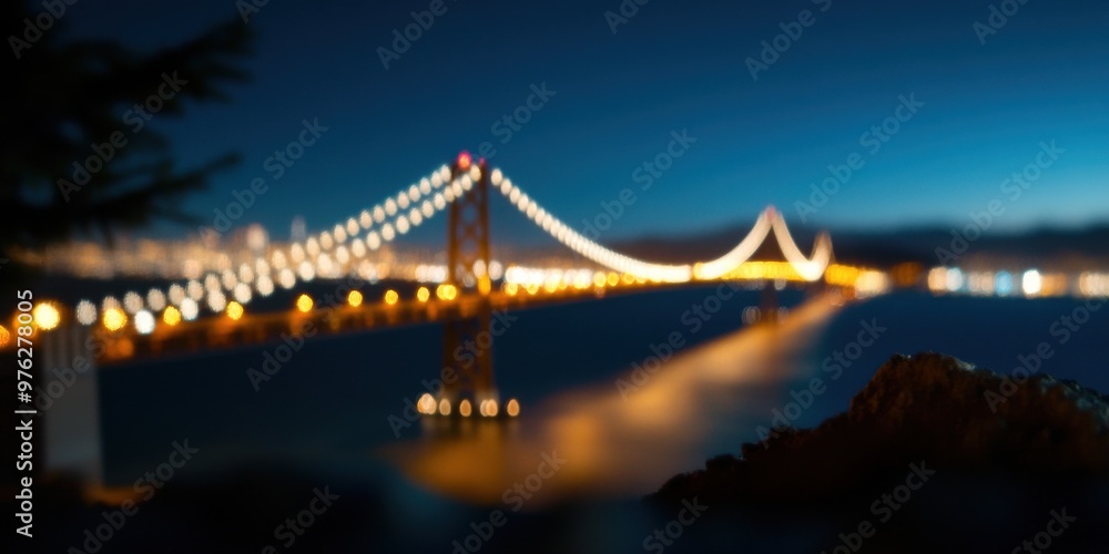 Fototapeta premium A stunning night view of a suspension bridge illuminated with lights, reflecting beautifully on the water below, symbolizing connection, structure, and modern engineering marvel.