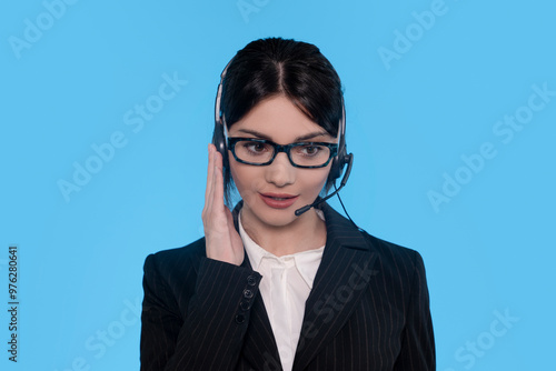 Professional Woman in Headset Engaged in Customer Service Call Against Vibrant Blue Background