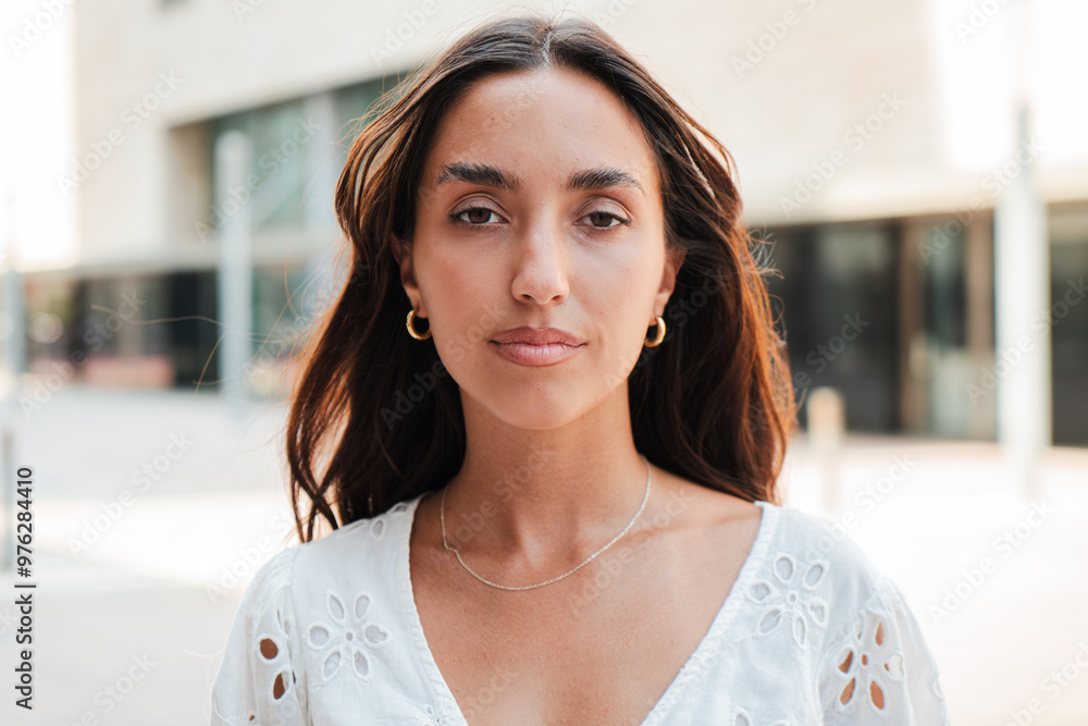 © Jose Calsina - Individual portrait of a Hispanic girl with a serious expression looking at camera. Young teenage woman staring front with a neutral demeanor. Only one Latin female gazing with a composed attitude © Jose Calsina - Individual portrait of a Hispanic girl with a serious expression looking at camera. Young teenage woman staring front with a neutral demeanor. Only one Latin female gazing with a composed attitude