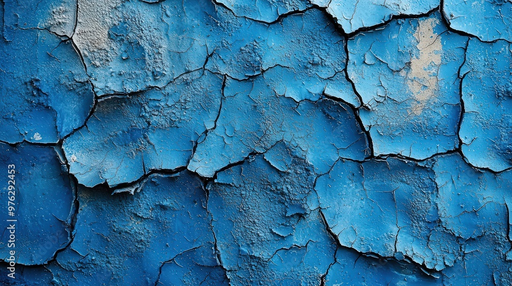 A gritty blue-painted concrete wall with large cracks spidering across its surface, the paint peeling away in jagged chunks, revealing the rugged, raw texture of the beton underneath. A gritty blue-painted concrete wall with large cracks spidering across its surface, the paint peeling away in jagged chunks, revealing the rugged, raw texture of the beton underneath.