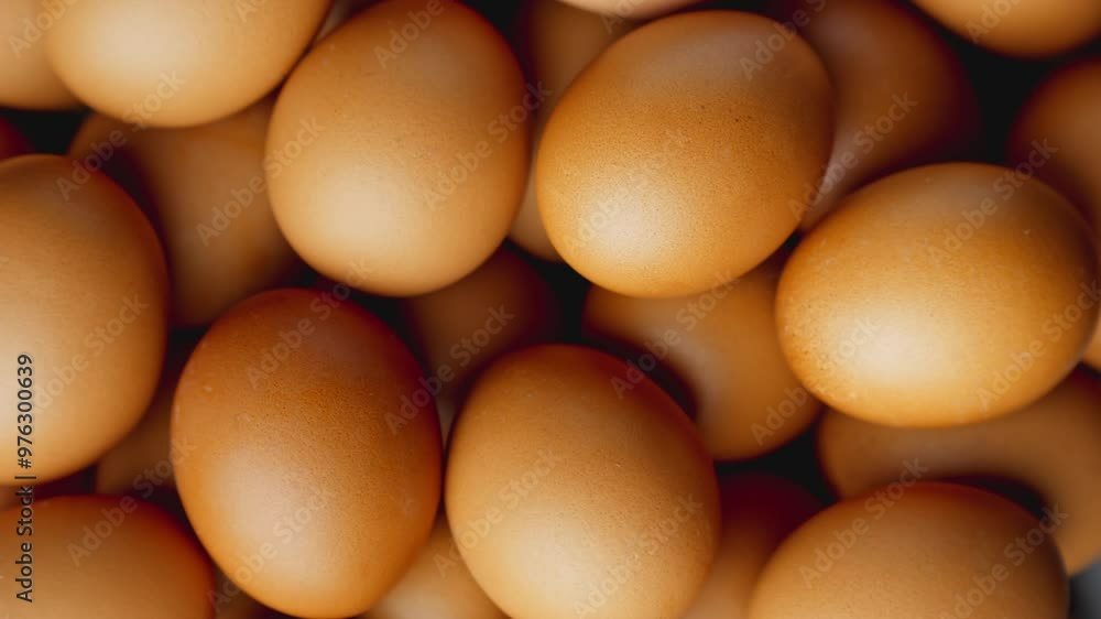 Pile of chicken eggs rotating. Organic food. GMO FREE farm product. Fresh chicken eggs. Healthy nutrition. Close-up in 4K, UHD Pile of chicken eggs rotating. Organic food. GMO FREE farm product. Fresh chicken eggs. Healthy nutrition. Close-up in 4K, UHD