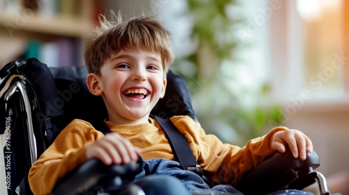 Smiling boy with SP in a wheelchair in the room. World Cerebral Palsy (SP) Day. Disabled child at home. The concept of treatment, education and inclusion of sick children into society