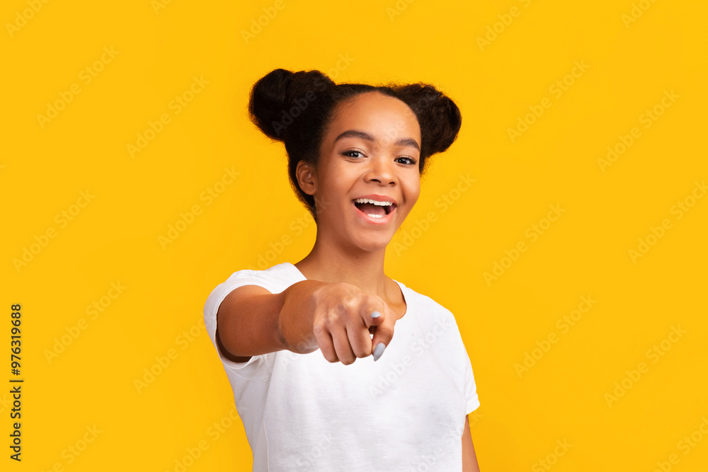 We Need You. Cheerful african american teen girl pointing finger at camera, free space, yellow background We Need You. Cheerful african american teen girl pointing finger at camera, free space, yellow background