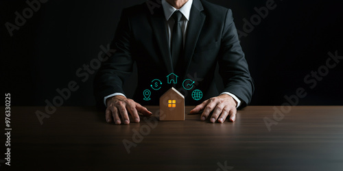 Businessman Protecting a House Model, Symbolizing Real Estate and Investment
