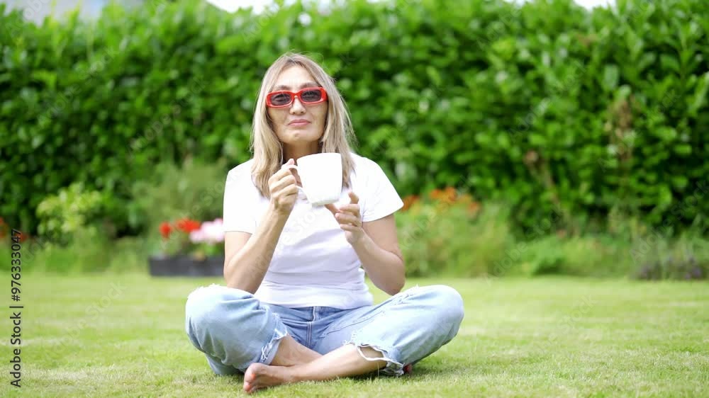 Enjoying Cozy Morning in Garden With Warm Cup on Sunny Day Enjoying Cozy Morning in Garden With Warm Cup on Sunny Day
