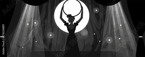 A woman is holding a hula hoop in a dark room