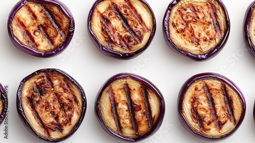 Delicate Lacy Pattern of Grilled Eggplant Slices Arranged in a Loose Spiral on a Bright White Background