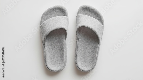 Soft gray home slippers, presented as a mockup design for hotel use, shown from a top-down view on a white background photo