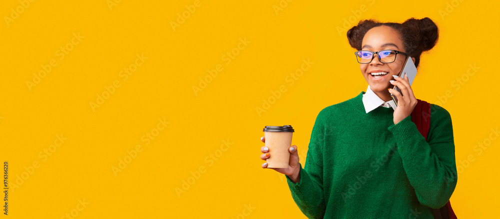 Always In Touch. Happy afro teenager talking on mobile phone drinking coffee, looking at copypace, panorama Always In Touch. Happy afro teenager talking on mobile phone drinking coffee, looking at copypace, panorama