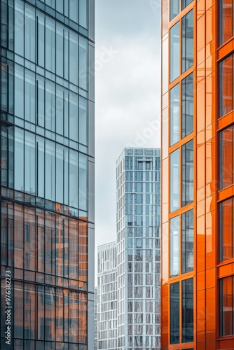 Modern urban architecture in a vibrant city under a bright blue sky filled wi...