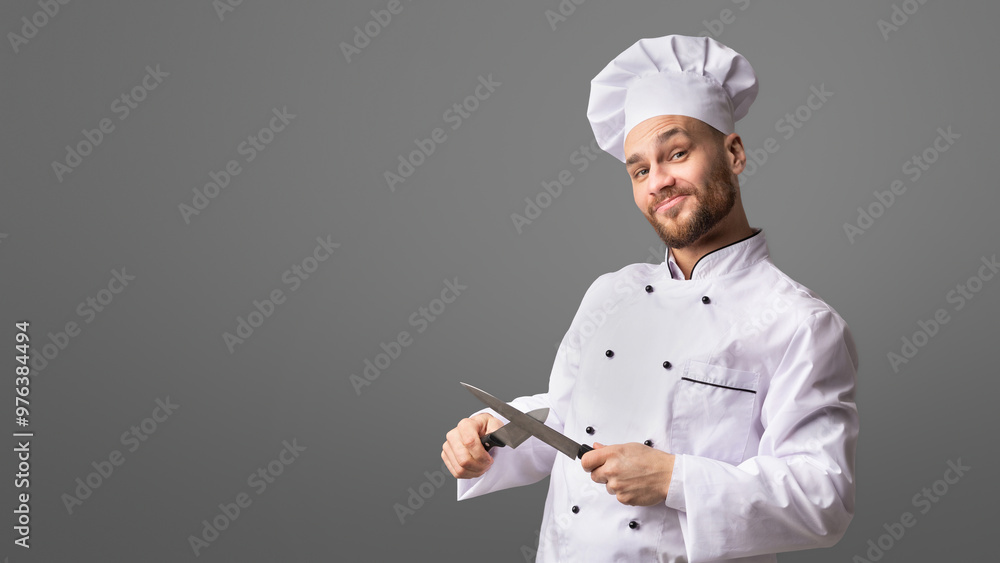 Funny Chef Man Sharpening Knives Standing Over Black Background. Cooking Food. Studio Shot, Panorama Funny Chef Man Sharpening Knives Standing Over Black Background. Cooking Food. Studio Shot, Panorama