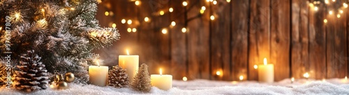 Christmas background with candles, a Christmas tree, and garland on a wooden wall with snow and lights. Free space for text or product display