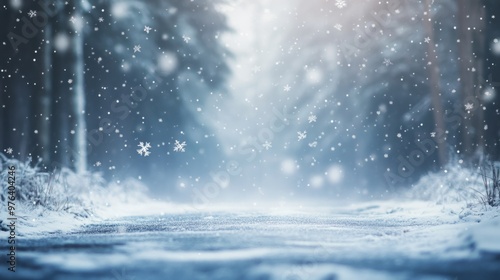 Beautiful winter background with falling snowflakes and a blurred forest. Christmas wallpaper with free space for text