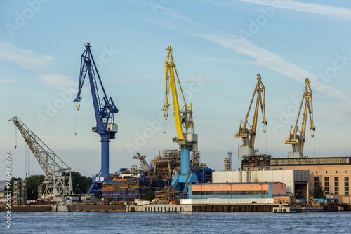 Russia. Saint-Petersburg. Cranes on the territory of shipbuilding plants in the Neva River.
