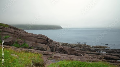 A pan across the shoreline of Cape Spear looking east across the Atlantic Ocean  photo