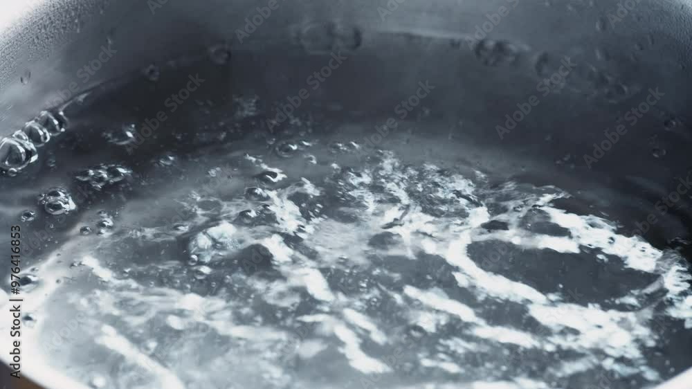 Close up of boiling water in metal pan, 4k Close up of boiling water in metal pan, 4k
