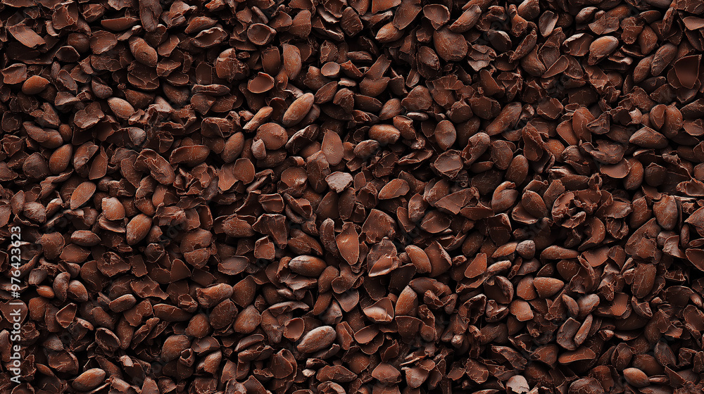 Obraz premium a seamless pattern of a close-up, top-down view of cocoa nibs, filling the entire frame with a focus on the intricate details of the elements