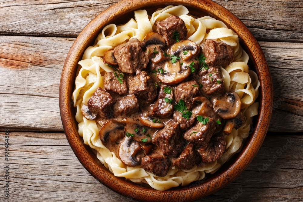 Beef and Mushroom Stroganoff with Egg Noodles in a Wooden Bowl Beef and Mushroom Stroganoff with Egg Noodles in a Wooden Bowl