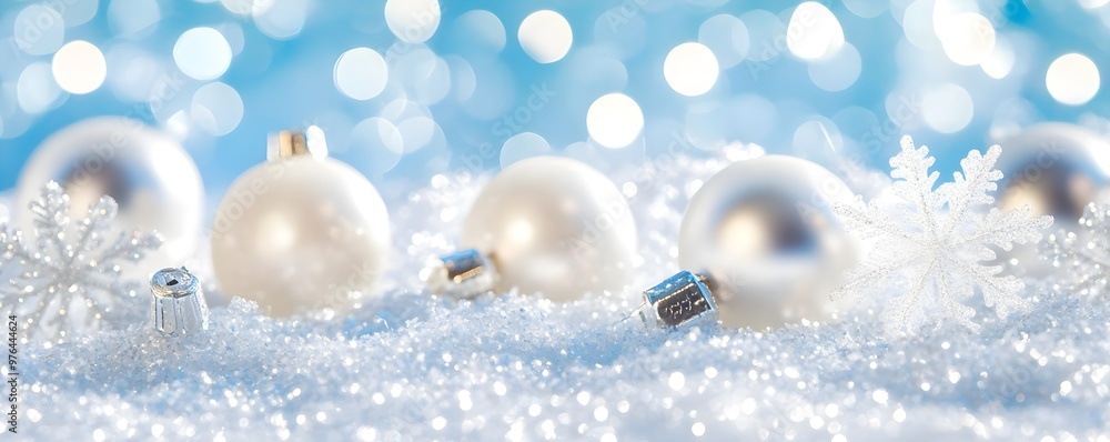 Silver Christmas Ornaments with Snowflakes on Blue Background Silver Christmas Ornaments with Snowflakes on Blue Background