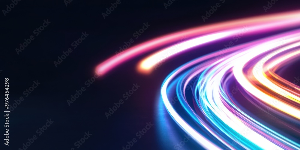 Naklejka premium Curved trails of multicolored lights create a dynamic pattern against a dark background, representing motion and energy in a visually striking, abstract artistic portrayal of speed.