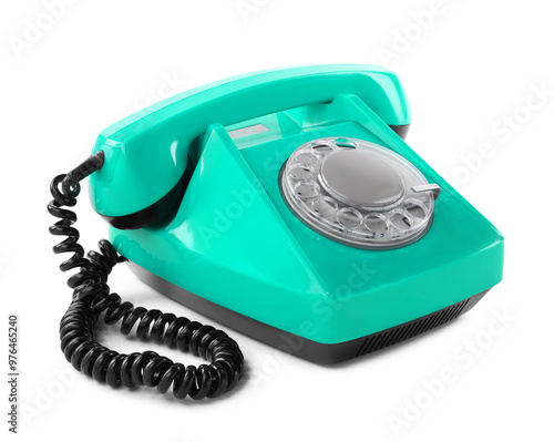 Old turquoise color telephone with rotary dial isolated on white