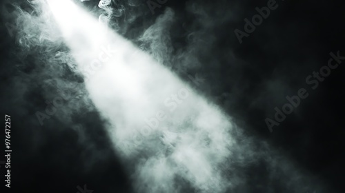 A Beam of Light Shining Through White Smoke on a Black Background