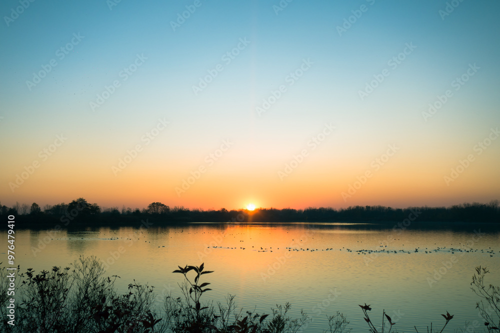 Tranquil Sunset Over a Calm Lake Tranquil Sunset Over a Calm Lake