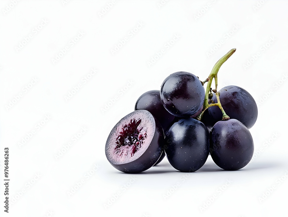 Fresh, juicy grapes displaying deep purple hues, perfect for healthy desserts or snacks, showcasing vibrant natural beauty. Fresh, juicy grapes displaying deep purple hues, perfect for healthy desserts or snacks, showcasing vibrant natural beauty.