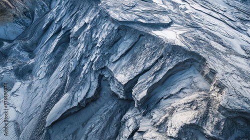 A close-up of volcanic ash deposits covering the landscape, with evidence of deformation in the ash layers photo