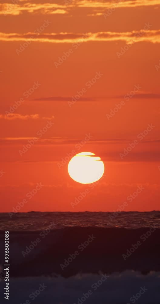 Clouds over the sea horizon and flying seagulls, ocean summer sunrise landscape with freedom birds in sky vertical view