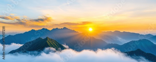 A stunning sunrise over misty mountains, showcasing vibrant colors and serene beauty, perfect for nature and landscape themes. photo