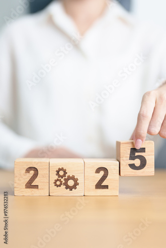 2024 year change to 2025 year block with gear icon. Business Process, Team, teamwork, Goal, Target, Resolution, strategy, plan, Action, motivation, change, brainstorm and New Year start concepts