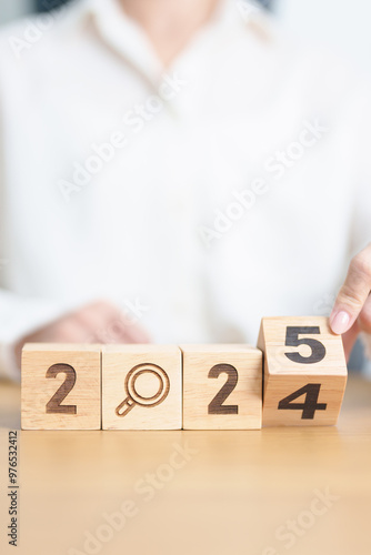2024 year change to 2025 year block with magnifying glass icon. SEO, Search Engine Optimization, hiring , Advertising, Idea, Strategy, marketing, Keyword, Content and New Year start concepts