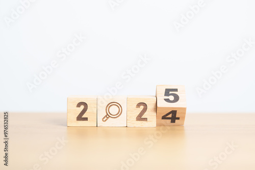 2024 year change to 2025 year block with magnifying glass icon. SEO, Search Engine Optimization, hiring , Advertising, Idea, Strategy, marketing, Keyword, Content and New Year start concepts