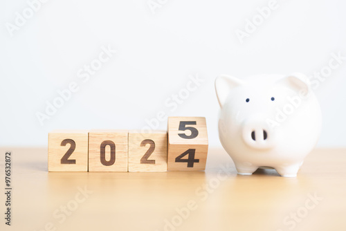 2024 end year to Happy New Year 2025 with piggy bank. Resolution, Goals, Plan, Action, Money Saving, Retirement fund, Pension, Investment and Financial concept photo